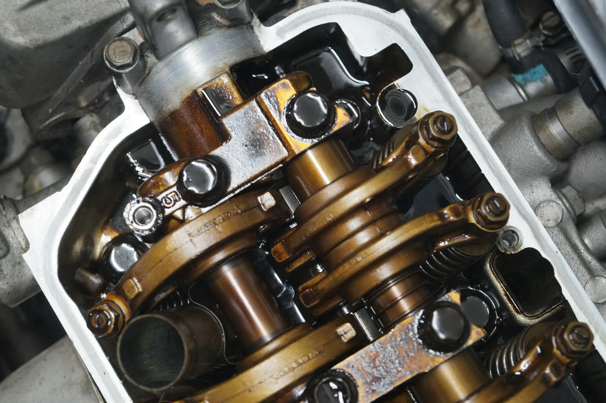 Close view of exposed engine timing components during repair