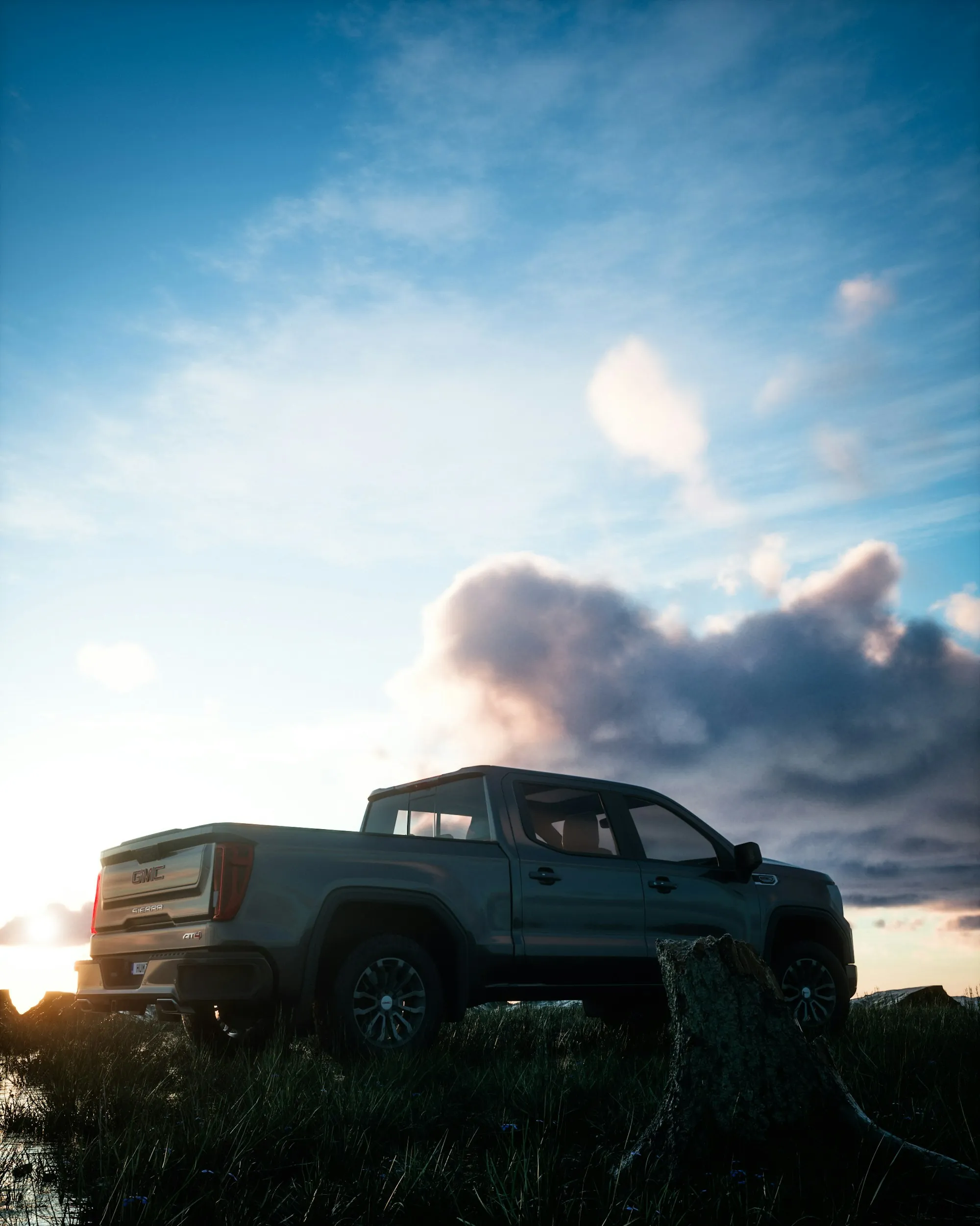 Pickup truck parked under a big mountain sky
